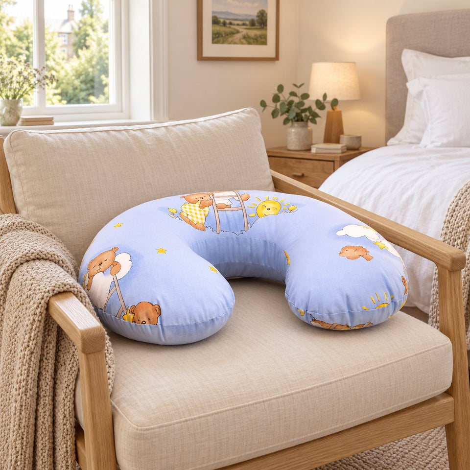 Blue teddy print nursing pillow on an armchair in a bright bedroom (AI-generated image)