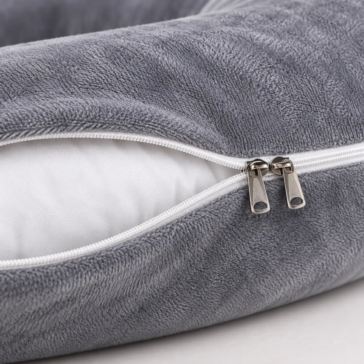 Close view of the zip-off grey velvet cover of the G Cloud