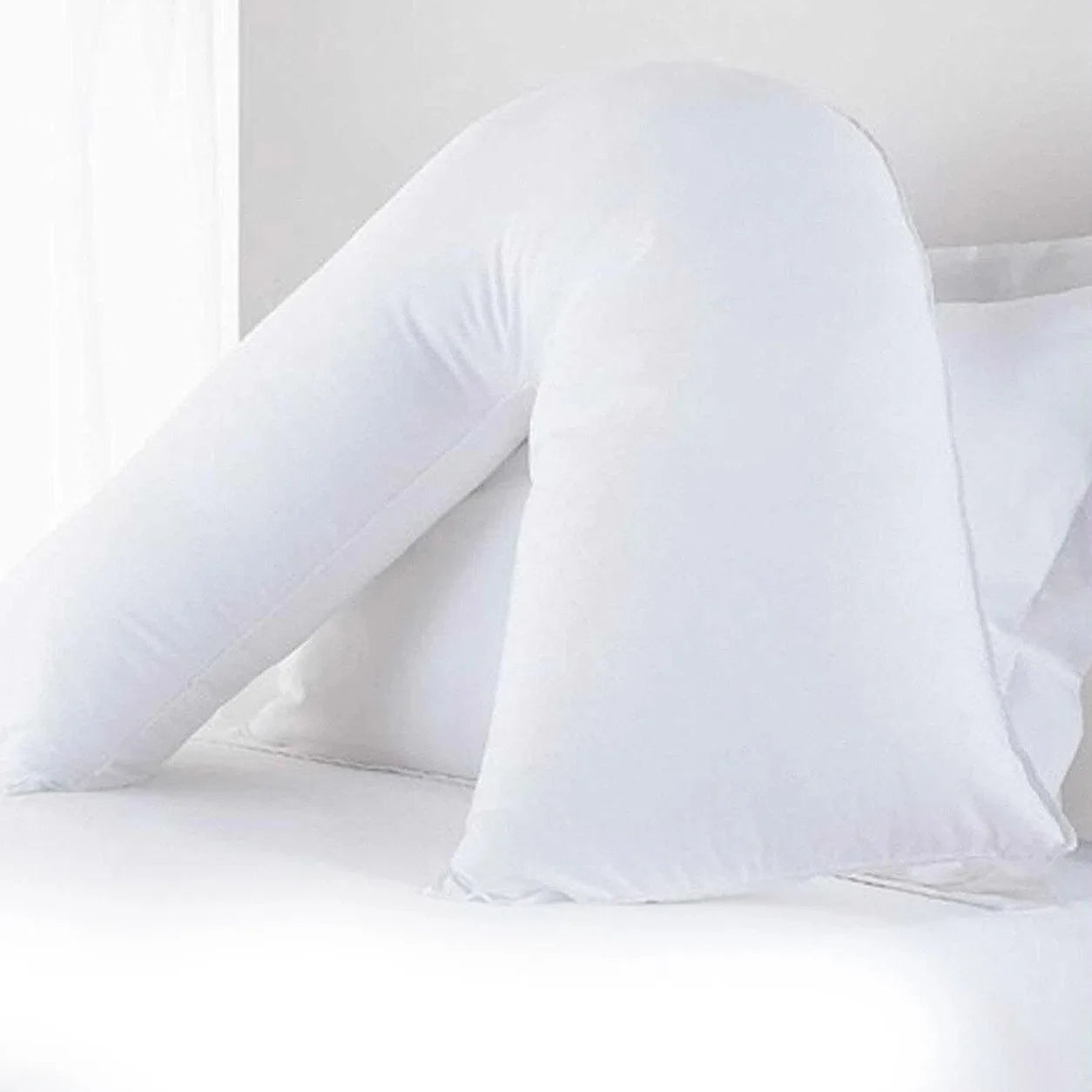 The V Pillow, a white V shaped pregnancy pillow
